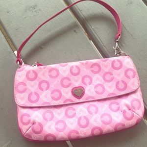 Coach small with covered with pink hearts